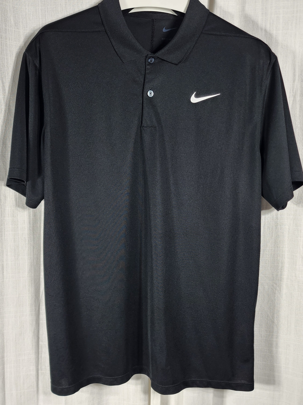 Nike Black Polo with White Swoosh Logo